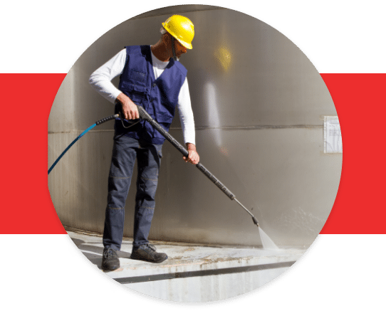 power washing the floor of an industrial area